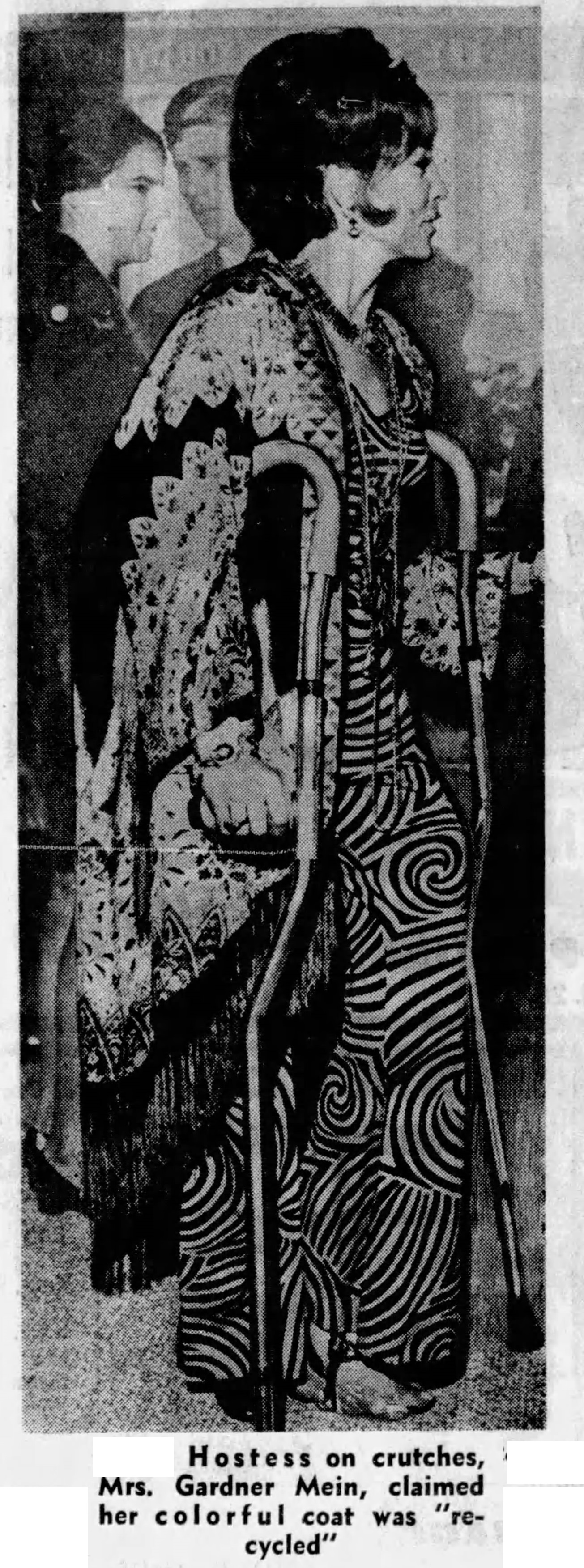 A well known San Francisco socialite, Mrs. Gardner (Lani) Mein had a spiral leg fracture from skiing and was in a full leg cast for months. Here, she is using Unistrut crutches.